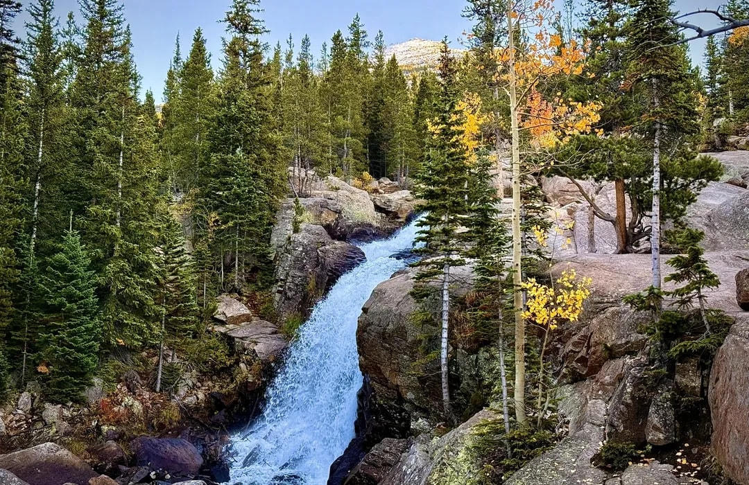 Placeholder: waterfall in pine and aspen